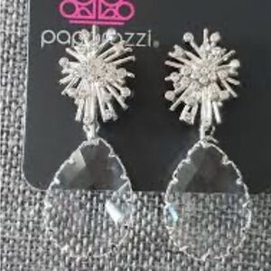 Stellar Paparazzi shooting star clear teardrop earrings.